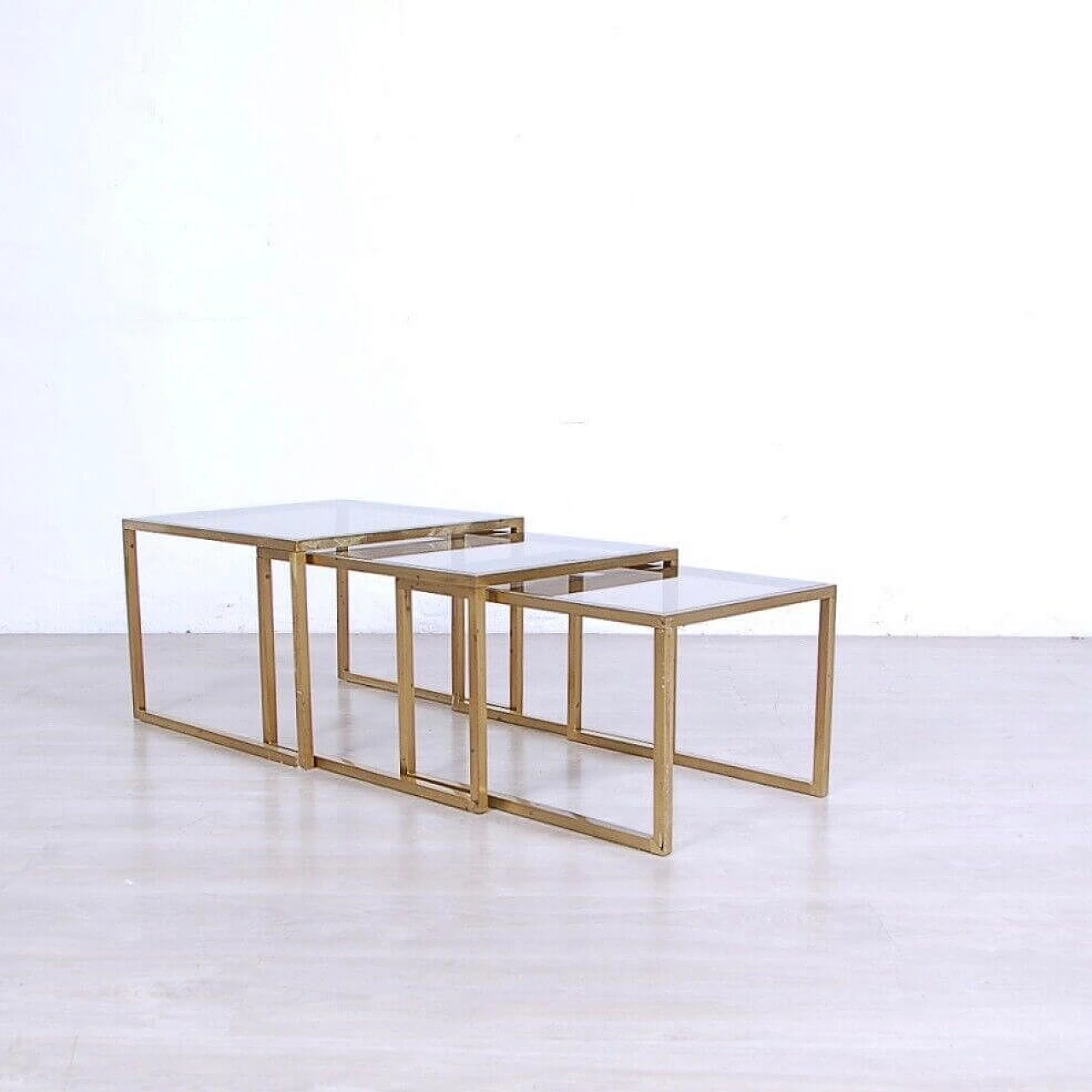 3 Nest coffee tables in brass and smoked glass, 1970s 2