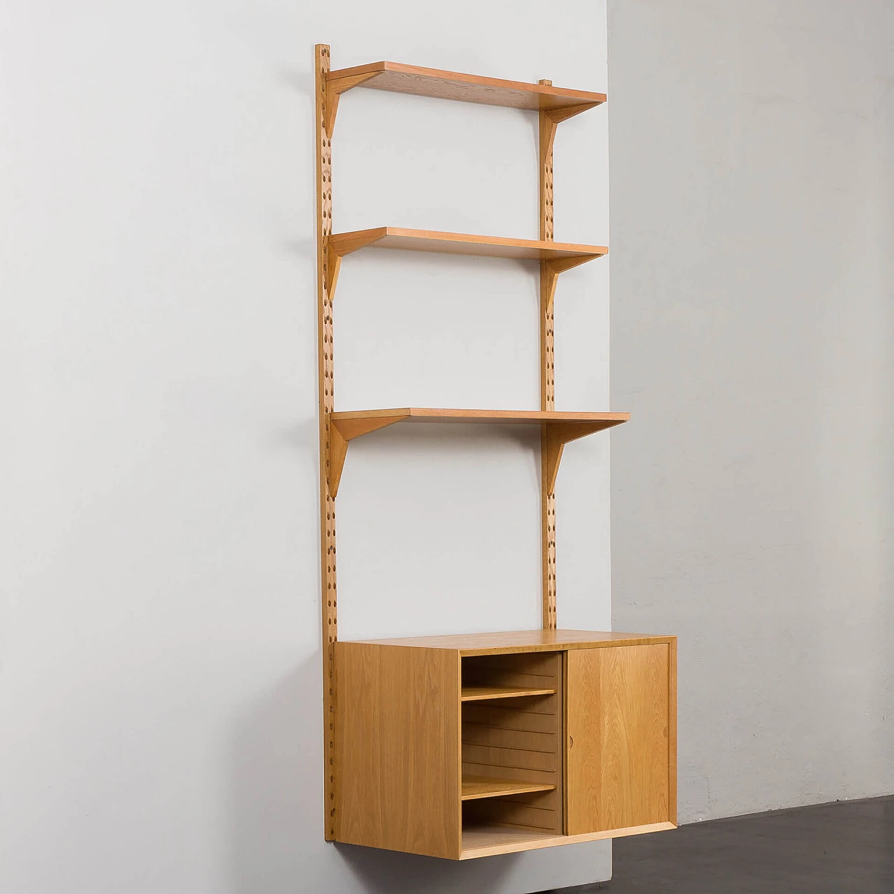 One-bay oak bookcase with sliding door cabinet by Poul Cadovius, 1960s 4