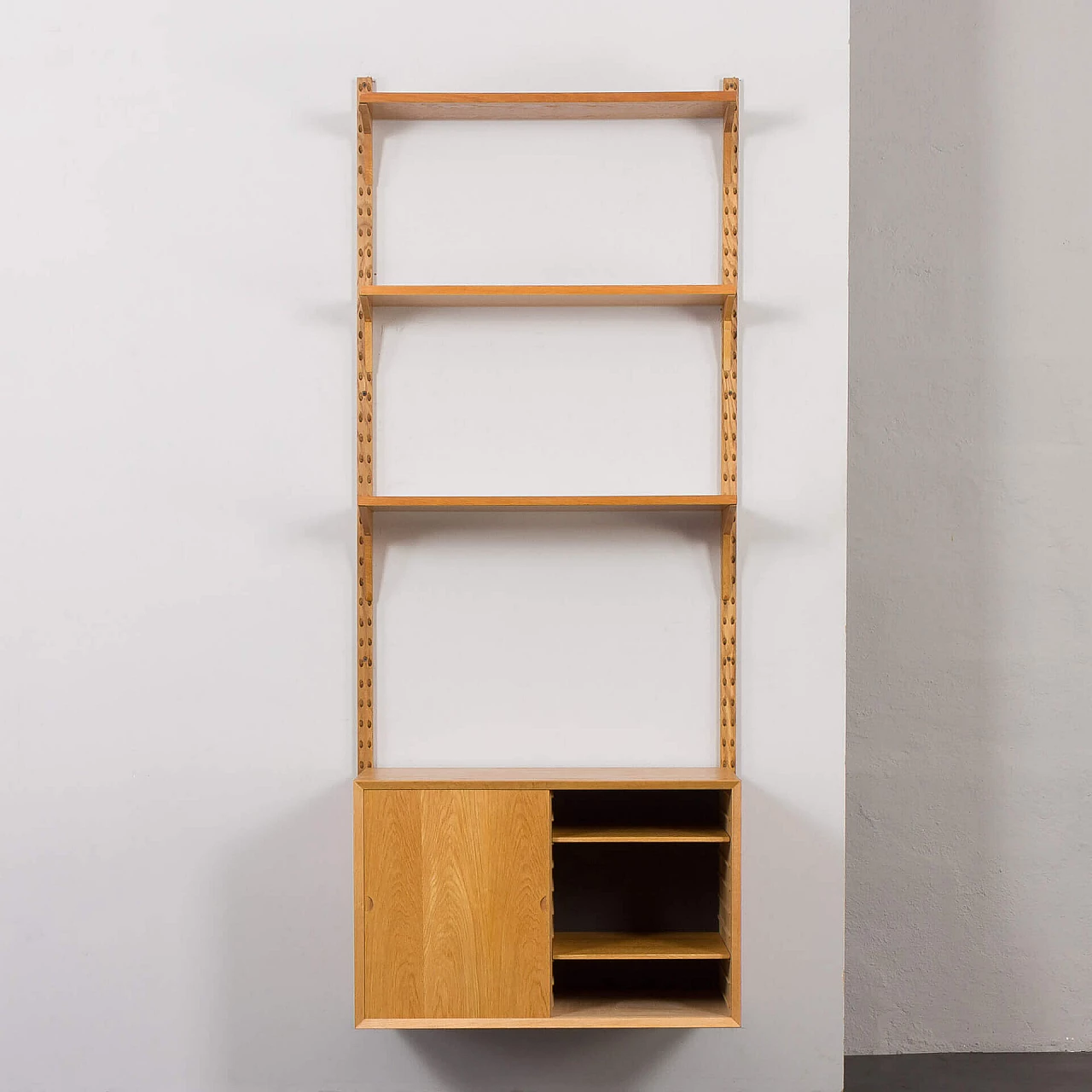 One-bay oak bookcase with sliding door cabinet by Poul Cadovius, 1960s 5