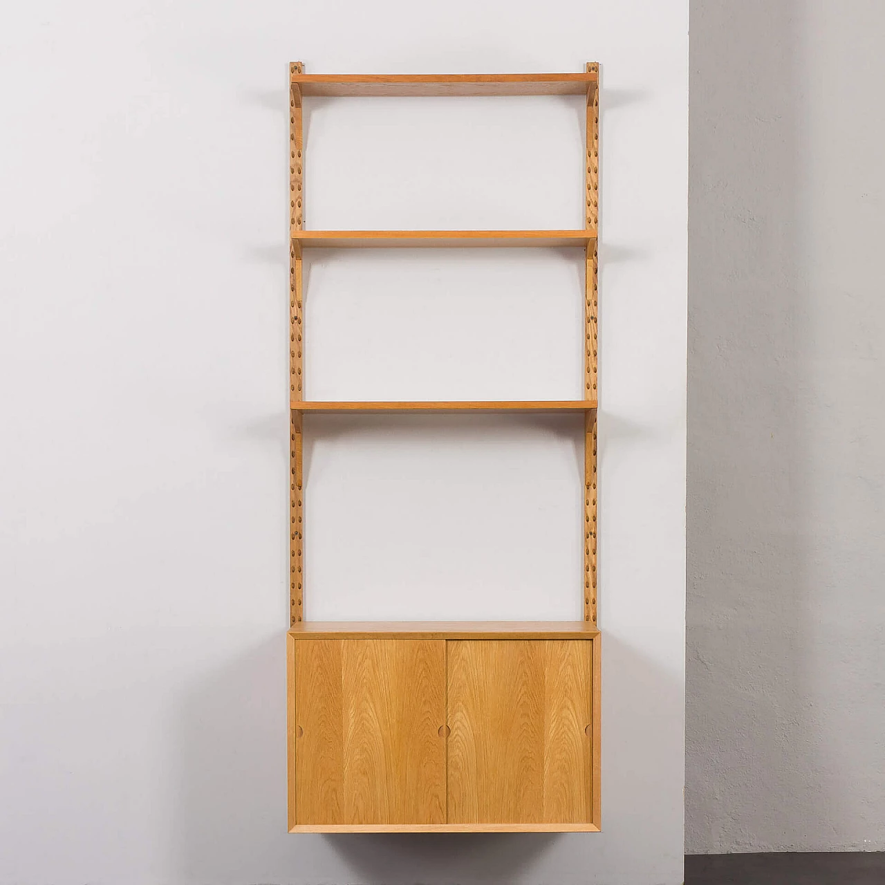 One-bay oak bookcase with sliding door cabinet by Poul Cadovius, 1960s 7