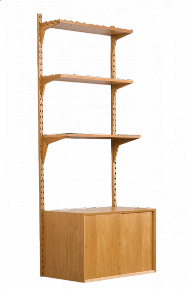 One-bay oak bookcase with sliding door cabinet by Poul Cadovius, 1960s