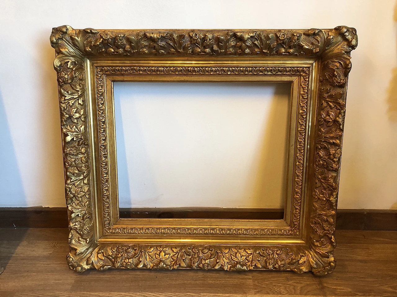 Carved and gilded wooden frame with leaf, 19th century 1