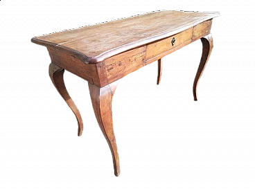 Walnut desk with central drawer and wavy legs, 18th century