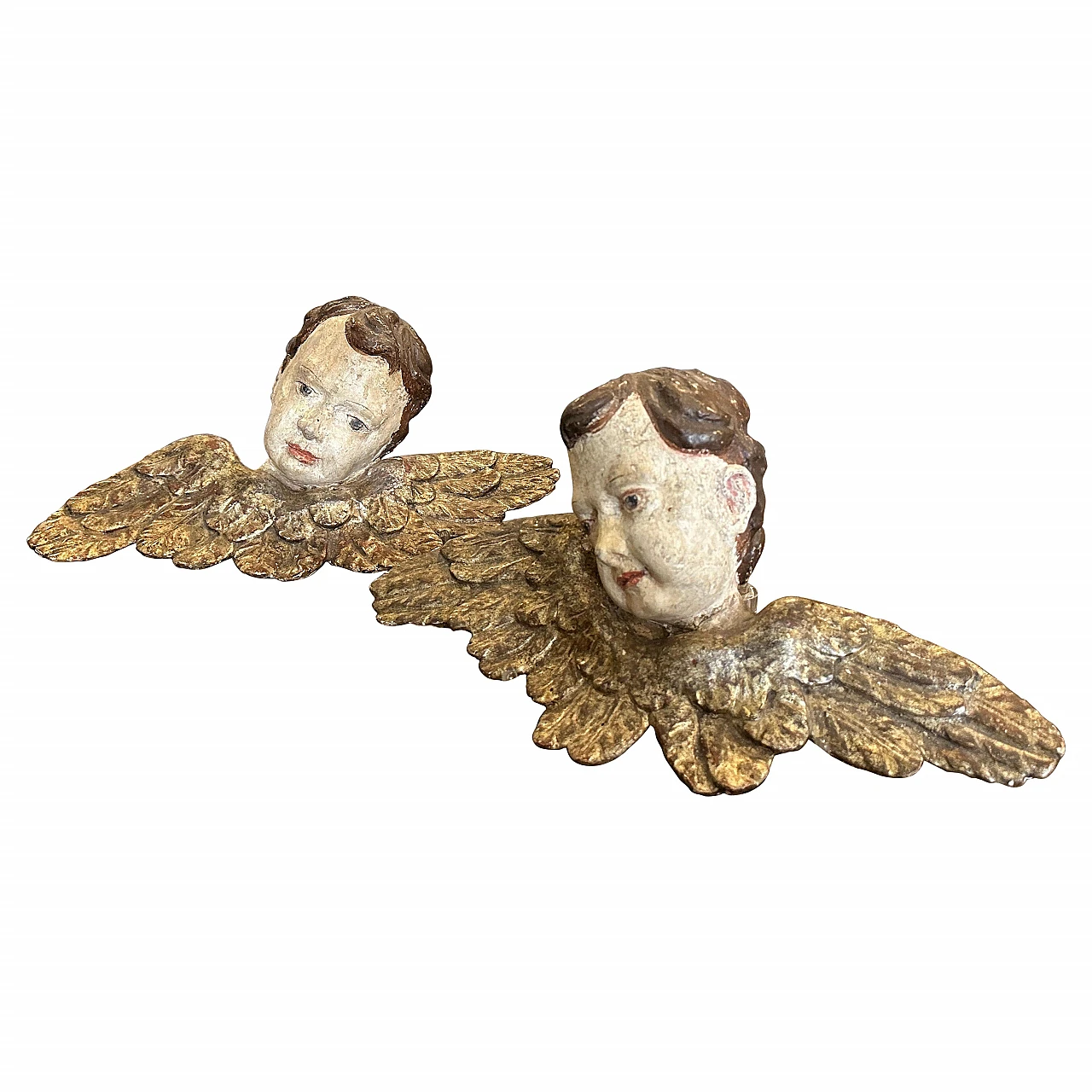 Pair of lacquered and carved wood winged angel heads, 1750s 1