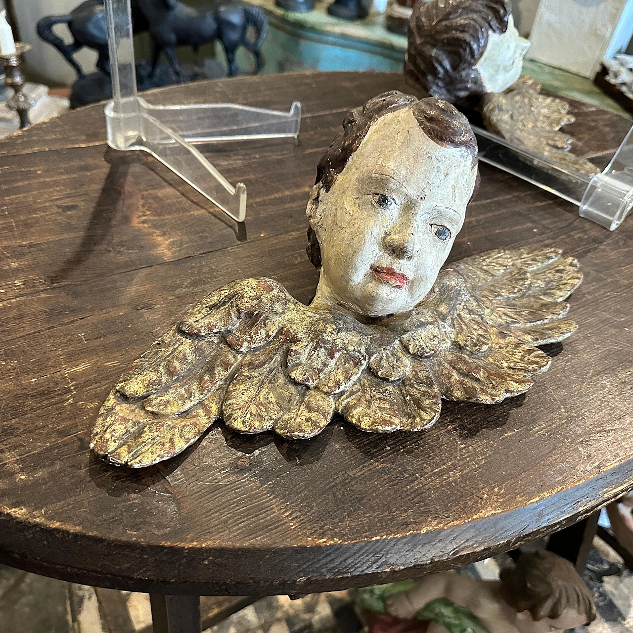 Pair of lacquered and carved wood winged angel heads, 1750s 4