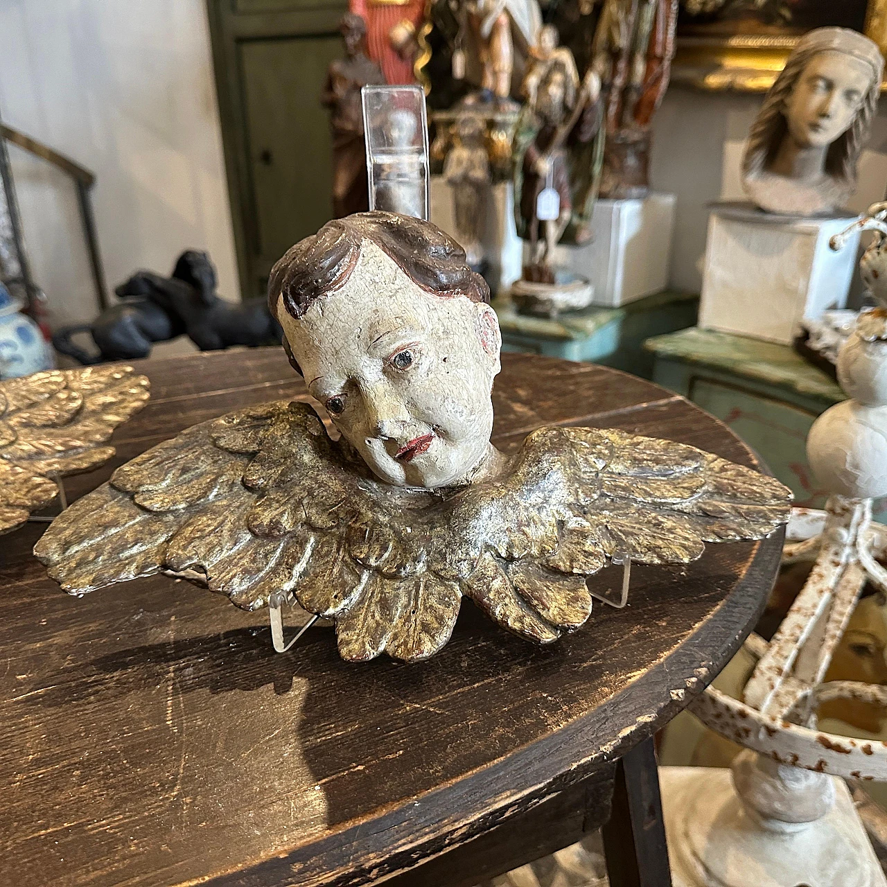 Pair of lacquered and carved wood winged angel heads, 1750s 11