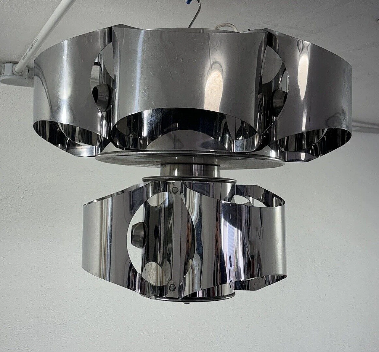 Curved chromed steel chandelier in the style of Max Sauze 1