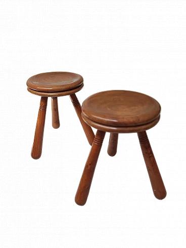 Pair of wooden tripod stools in the style of Charlotte Perriand, 1970s