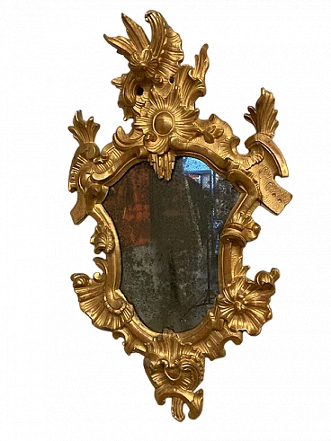 Mirror carved on solid wood and gilded with gold leaf, 18th century