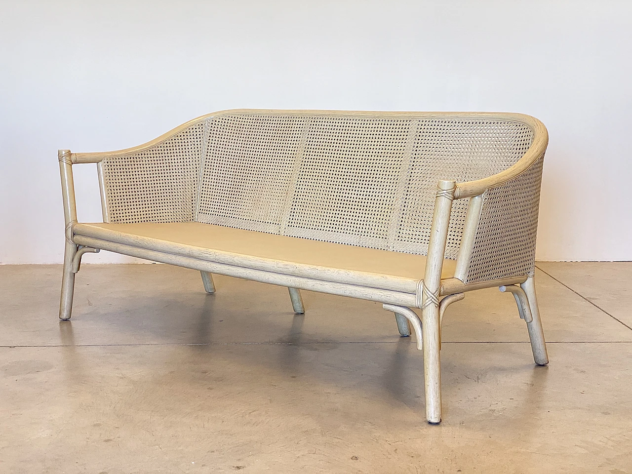 Sofa in laquered wood and Vienna straw with cushions by McGuire, 1970s 6