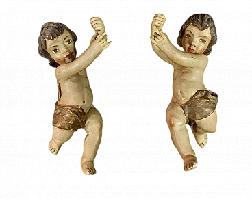 Pair of polychrome wood putto sculptures, late 19th century