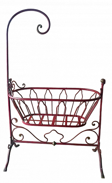 Red wrought iron cradle with gilded details, mid-19th century