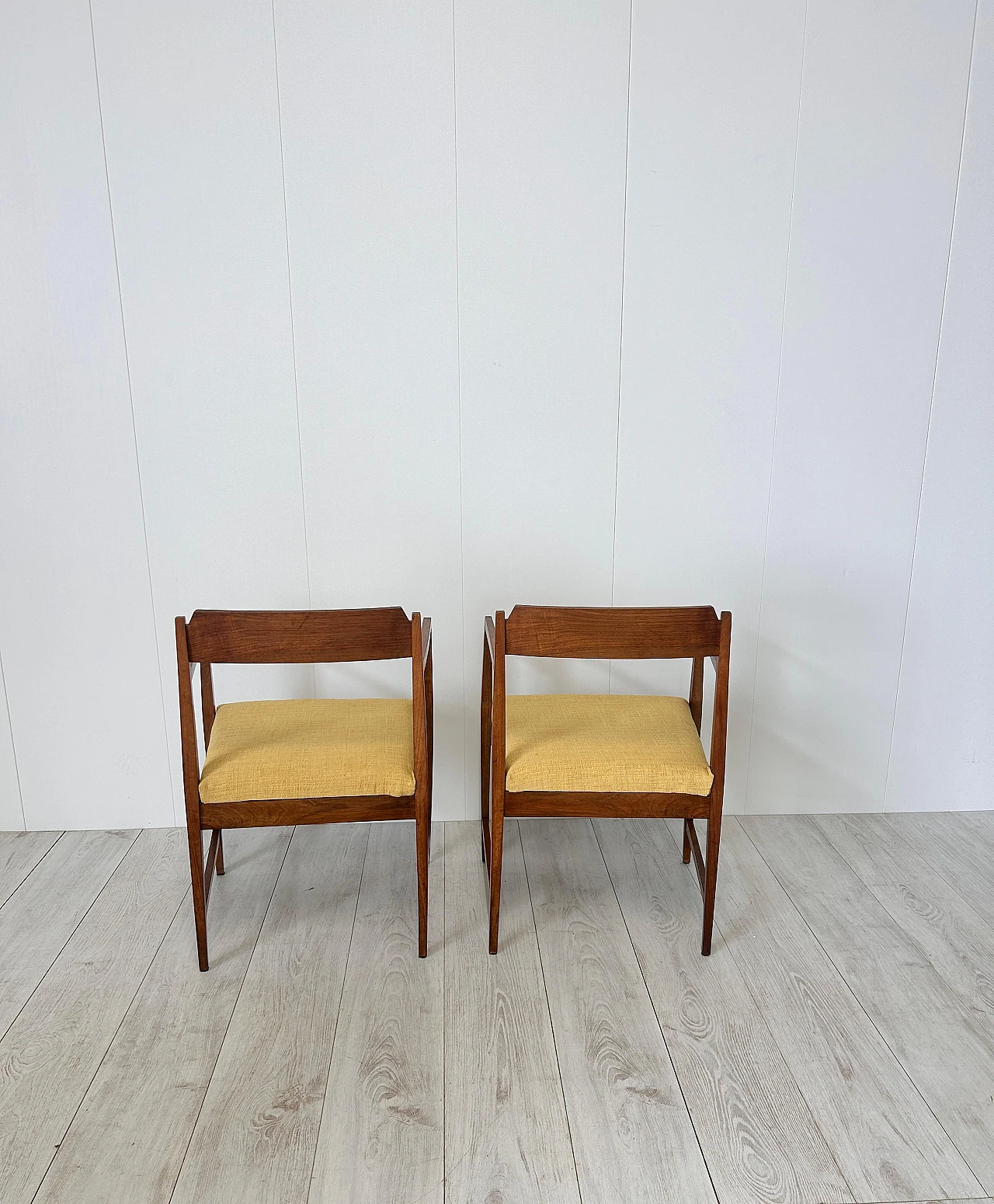 Pair of wood and fabric armchairs with footstools, 1950s 13