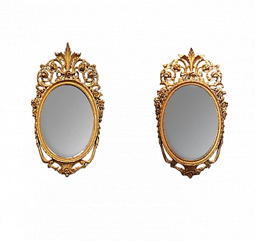 Pair of oval mirrors in wood gilded with gold leaf, late 18th century