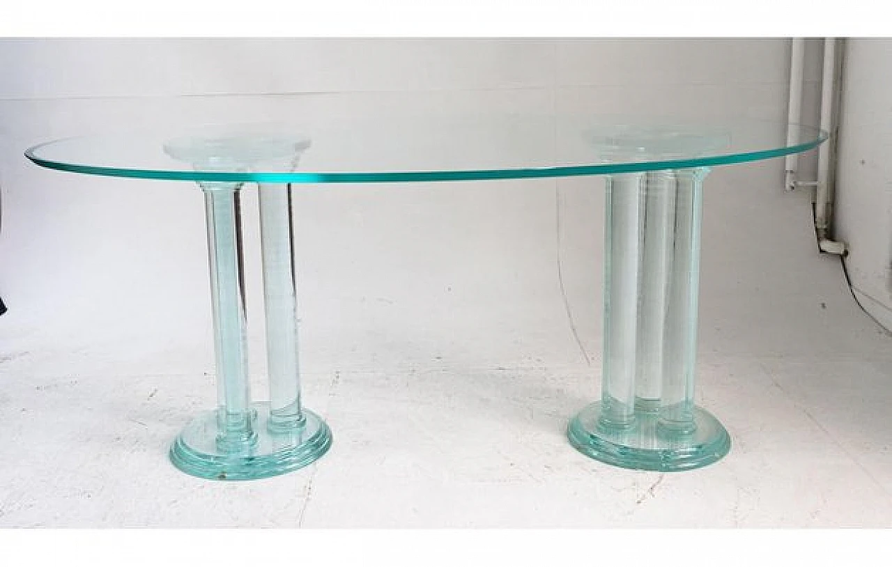 Oval glass dining table with acrylic glass column legs, 1970s 1