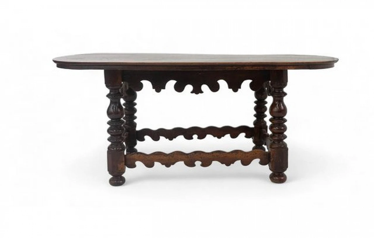 Wooden table with oval top and carved legs, 19th century 1