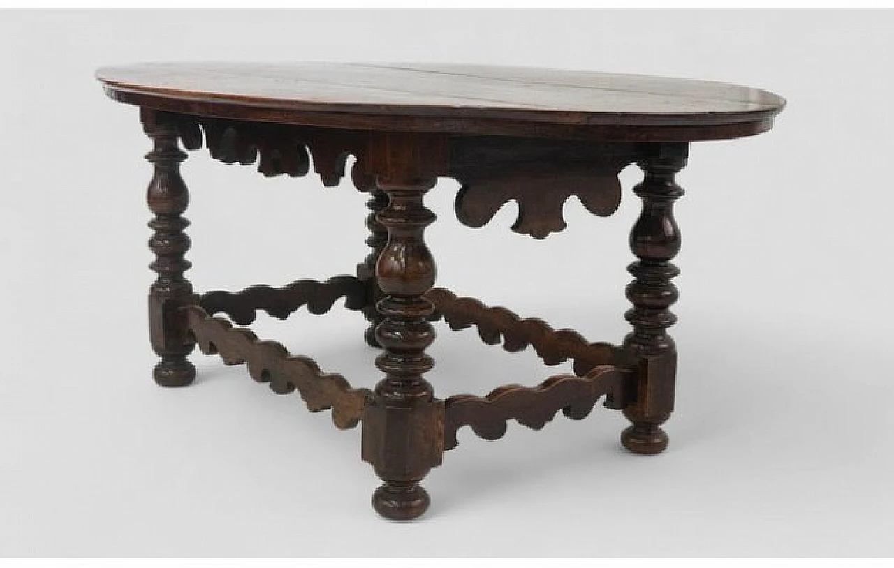 Wooden table with oval top and carved legs, 19th century 4