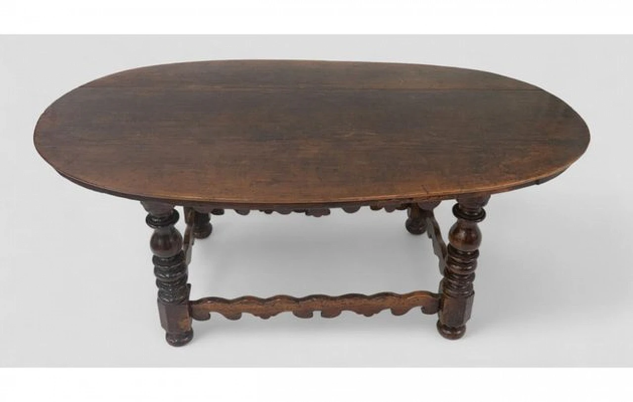 Wooden table with oval top and carved legs, 19th century 5