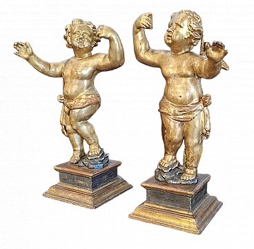 Pair of putti in gilded wood, 17th century