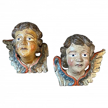 Angel heads, pair of lacquered wood sculptures, mid-18th century