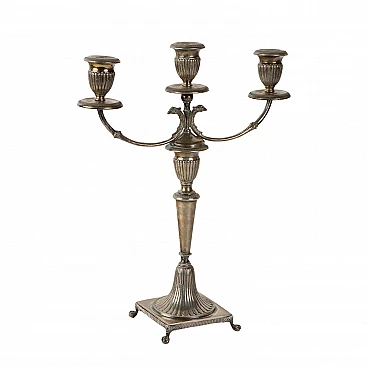 Three-armed silver candelabra with four ferine-shaped feet