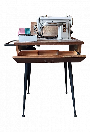 Singer sewing machine with folding work table, 1960s