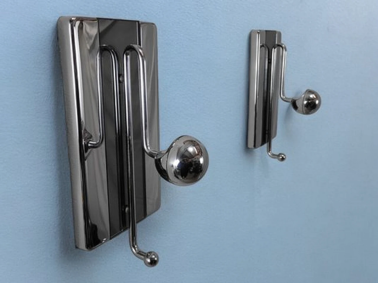 Pair of chromed metal and plastic wall clothes hangers, 1970s 1