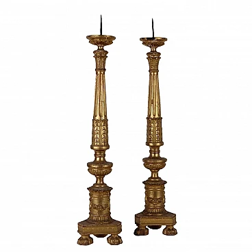 Pair of carved & gilded wooden torch holders with decors, 19th century
