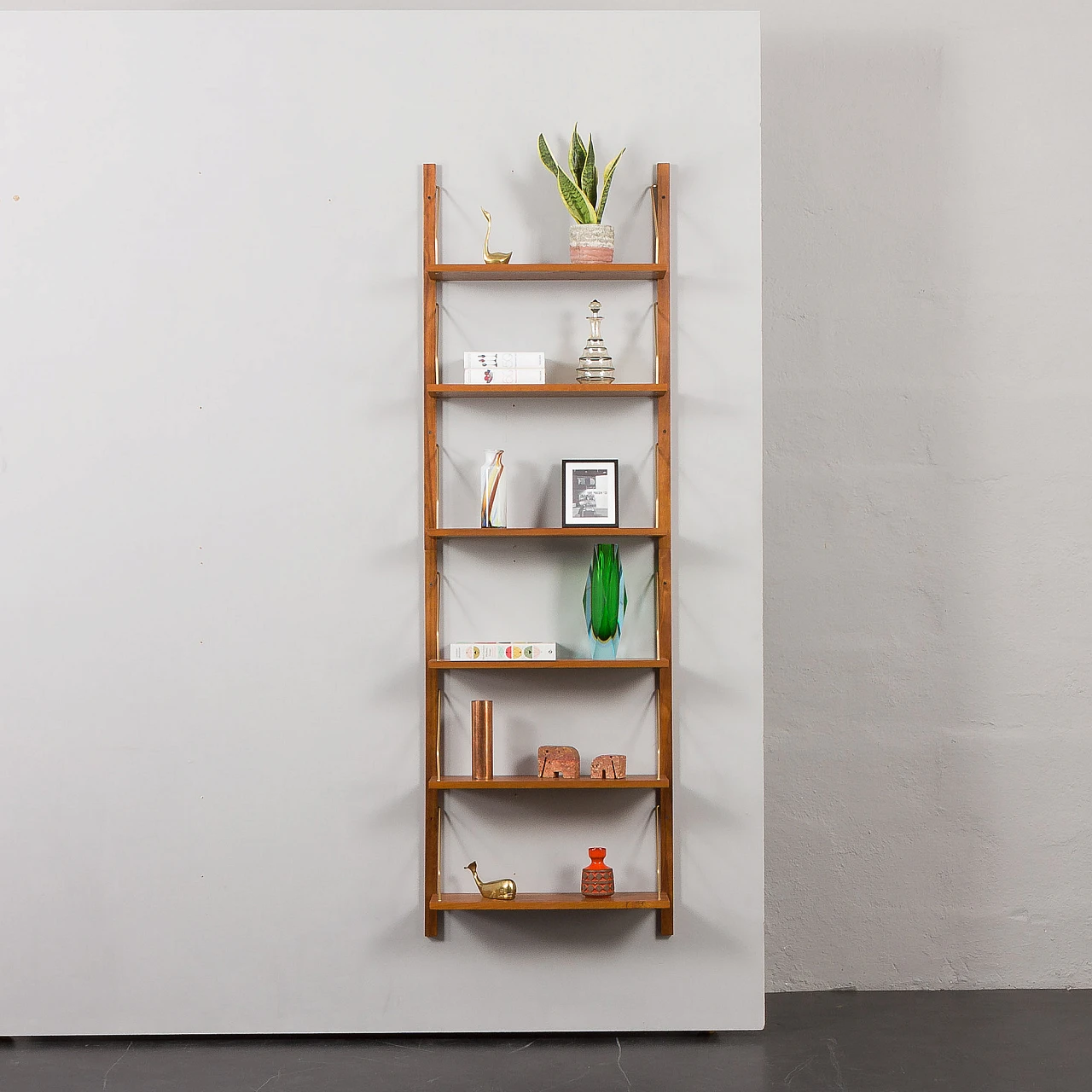 Teak and brass hanging bookcase in the style of Cadovius and Sorensen 3