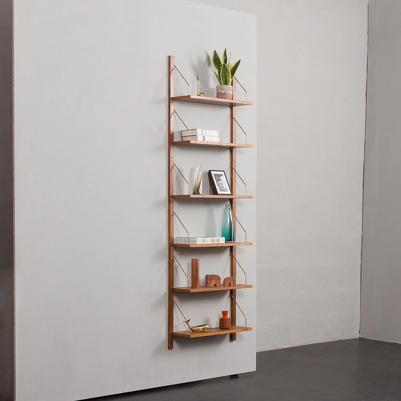 Teak and brass hanging bookcase in the style of Cadovius and Sorensen 4