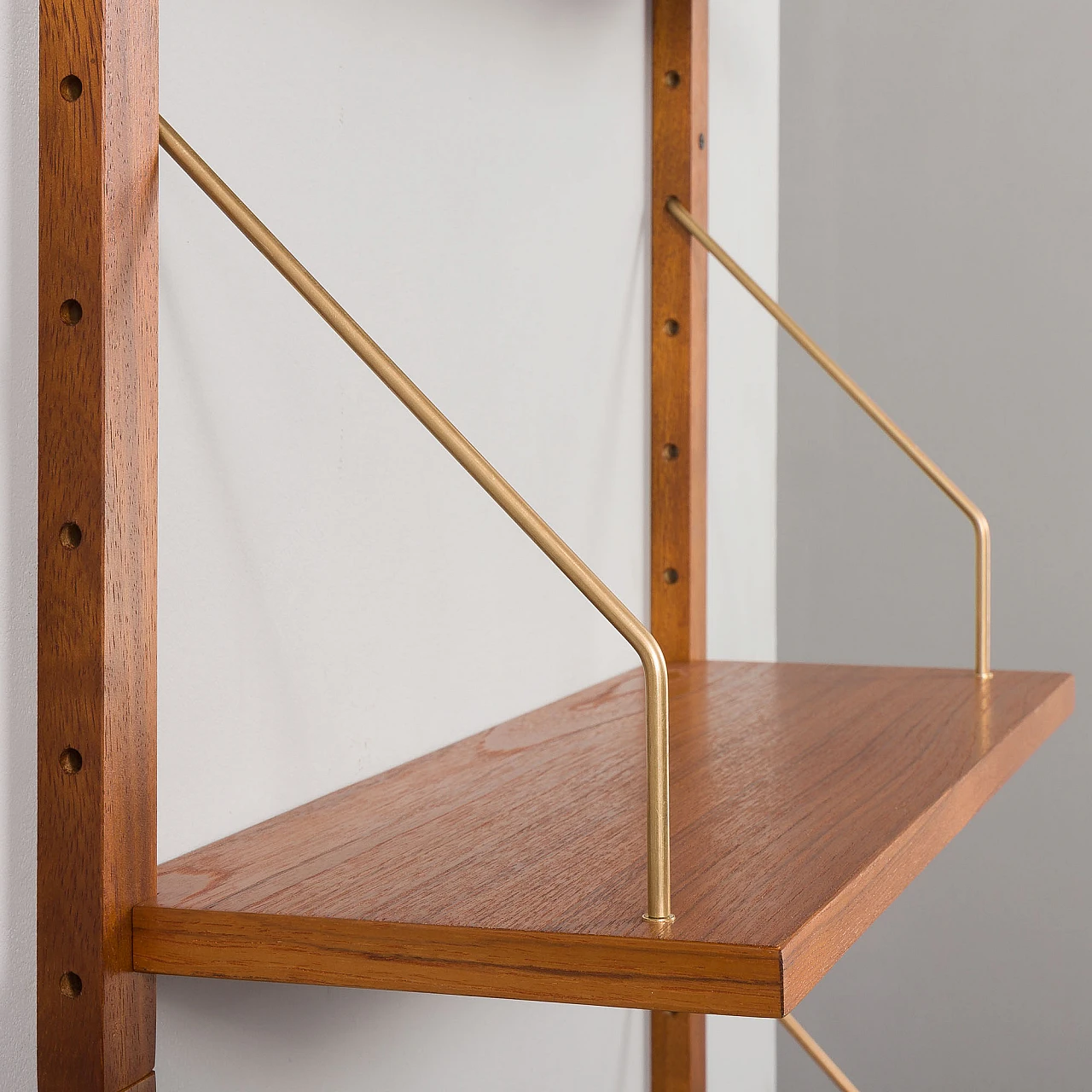 Teak and brass hanging bookcase in the style of Cadovius and Sorensen 8