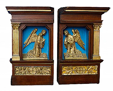 Pair of walnut niches with bas-reliefs of archangels, mid-19th century