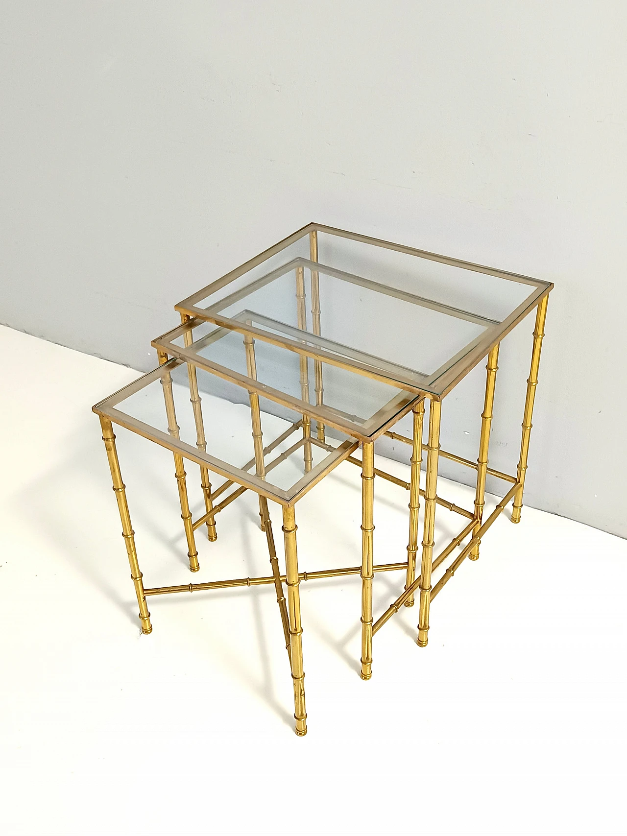 3 Nesting tables in brass and glass in the style of J. Adnet, 1960s 1