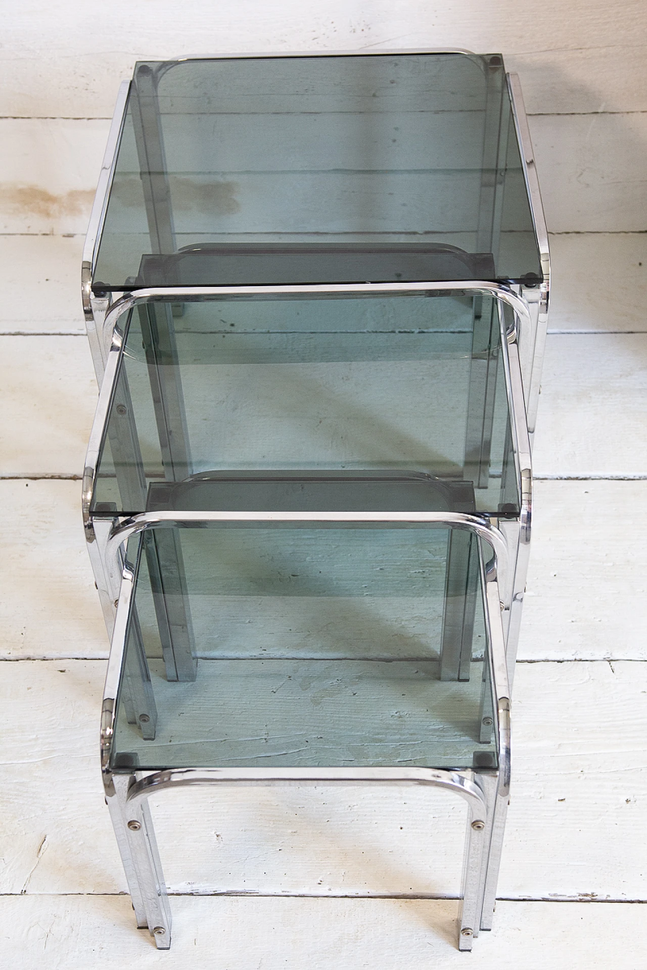 3 Nesting tables in chromed metal and smoked glass, 1970s 1