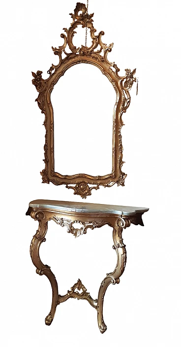 Carved and gilded wooden console table with mirror, early 20th century