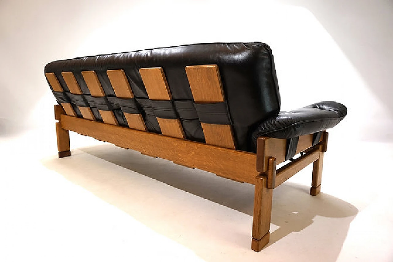 Solid oak and black leather three-seater sofa, 1960s 7