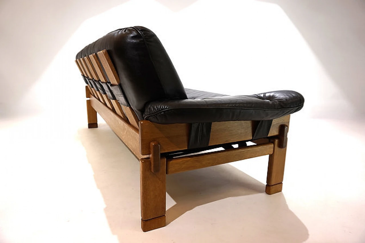 Solid oak and black leather three-seater sofa, 1960s 10