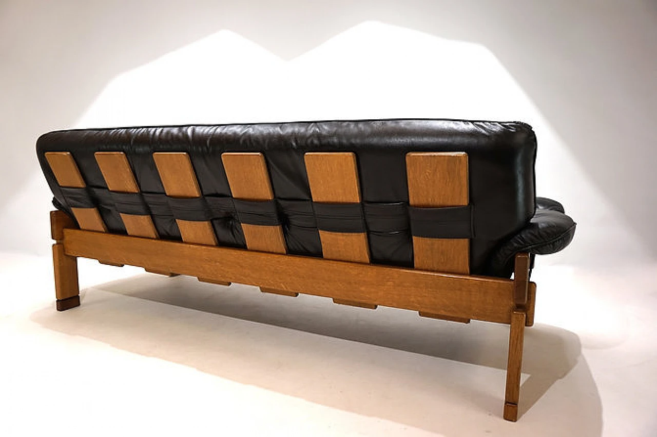 Solid oak and black leather three-seater sofa, 1960s 11