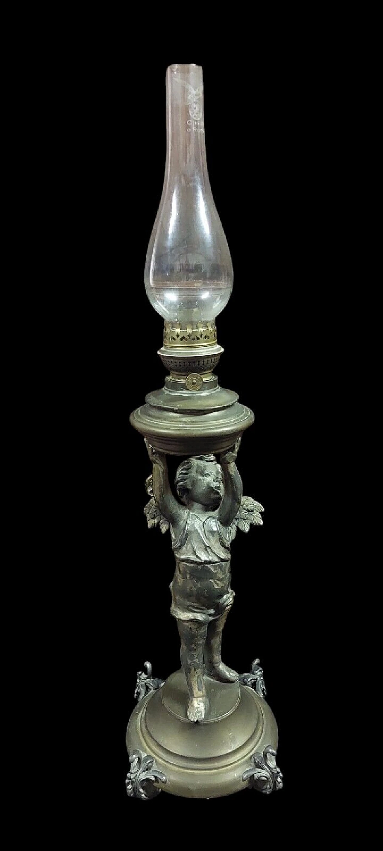 Antimony and brass oil lamp with winged putto, 19th century 1