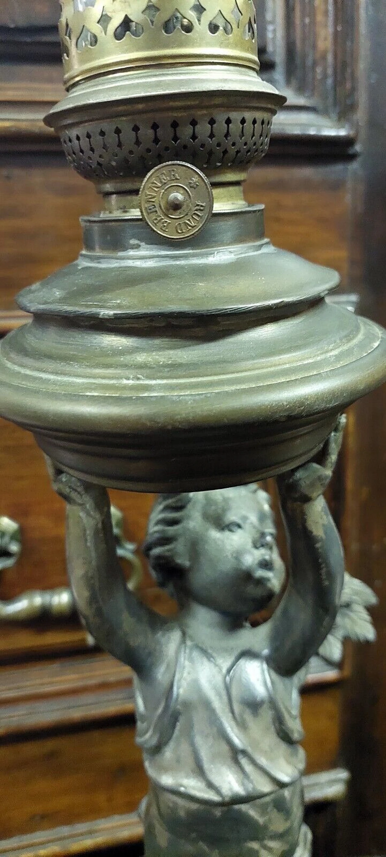 Antimony and brass oil lamp with winged putto, 19th century 7