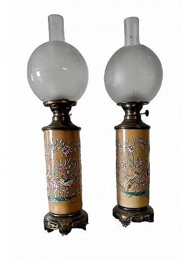 Pair of bronze and glazed ceramic oil lamps, early 20th century