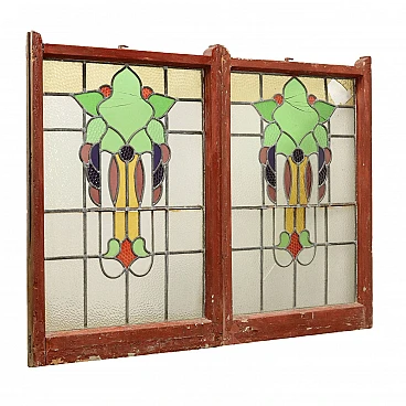 Pair of Art Nouveau leaded and stained glass windows with flowers