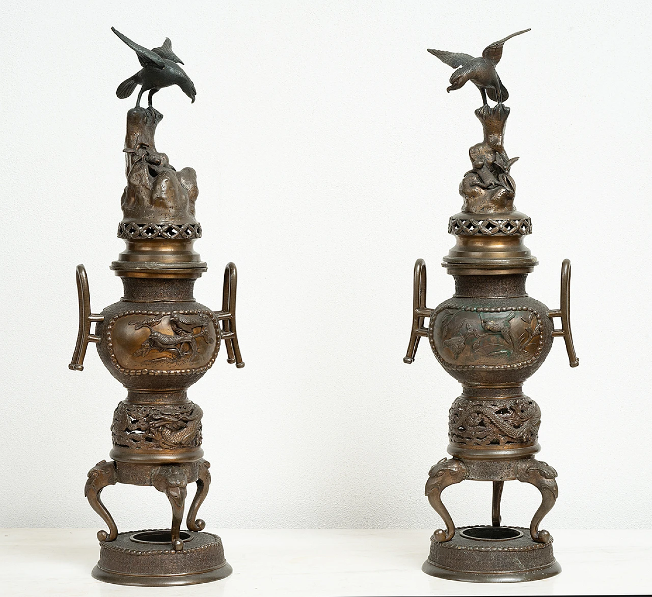 Pair of patinated antimony smoke-burning vases, early 20th century 1