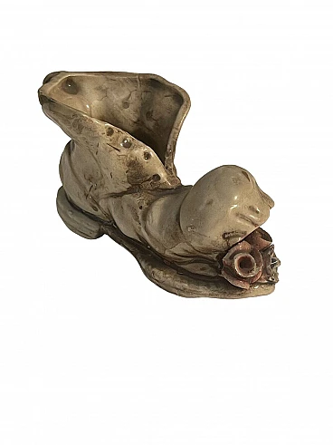 Polychrome ceramic broken shoe figurine