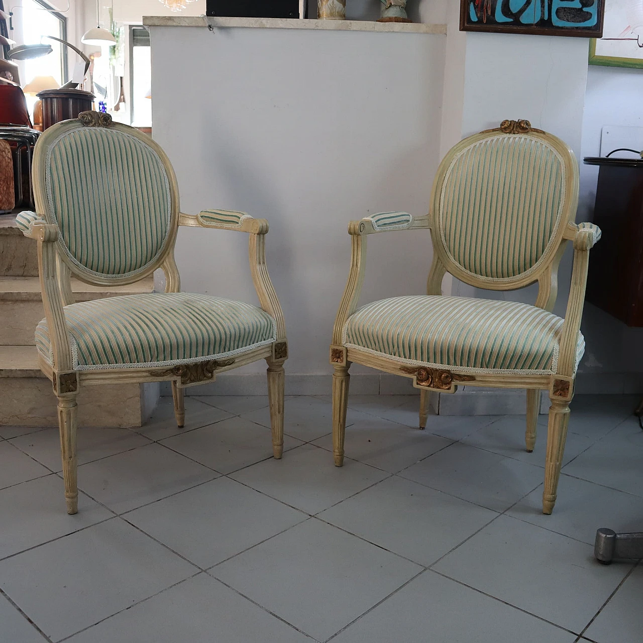 Pair of Louis XVI armchairs in laquered wood & gold leaf details 1