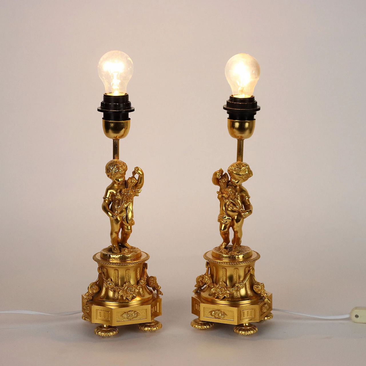 Pair of gold plated bronze table lamps by F.B.A.I. 1