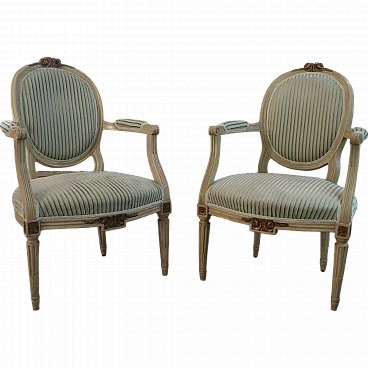 Pair of Louis XVI armchairs in laquered wood & gold leaf details