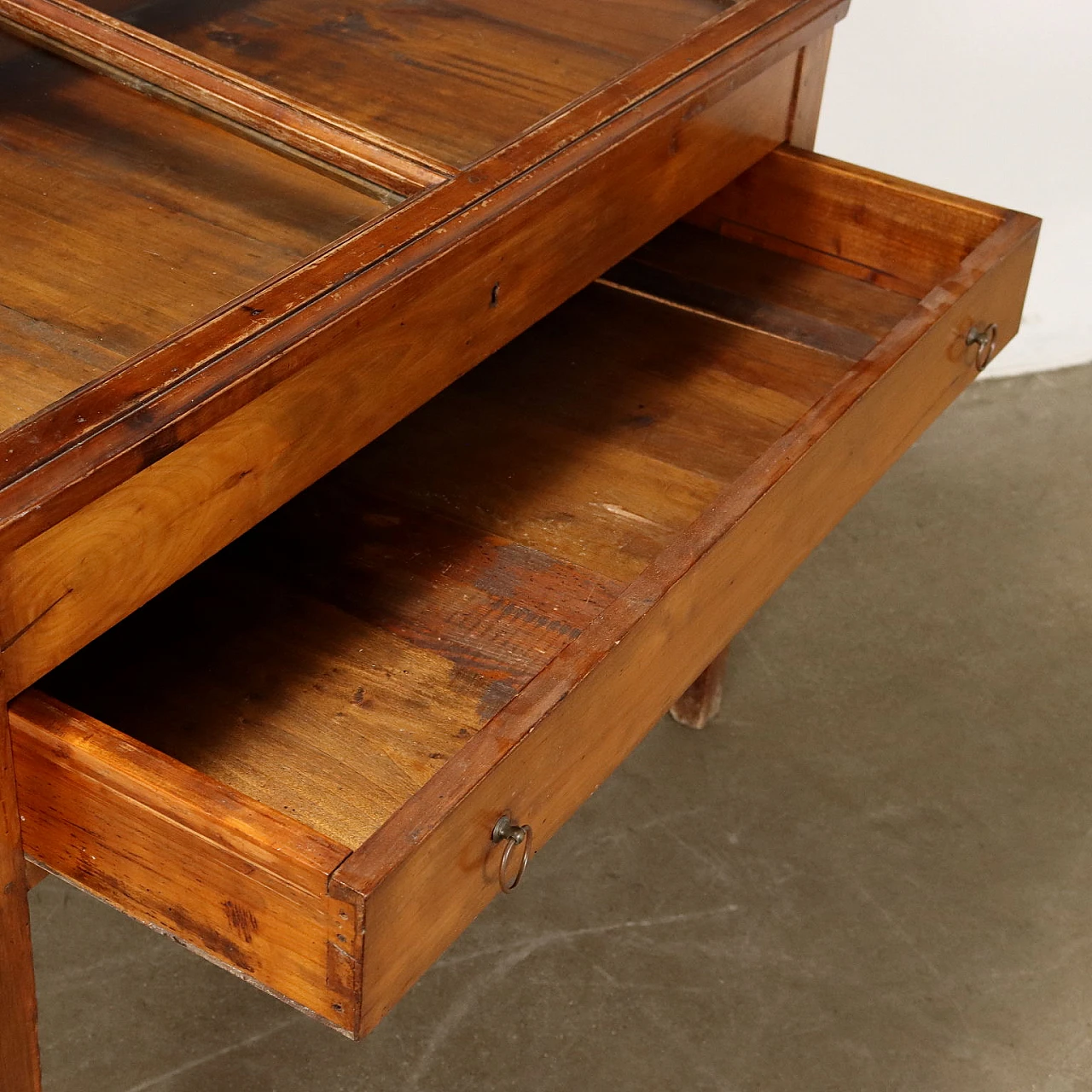 Stained poplar table with drawer and glass case, 19th century 5