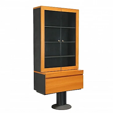 Tanganyika walnut veneered showcase with metal base, 1980s