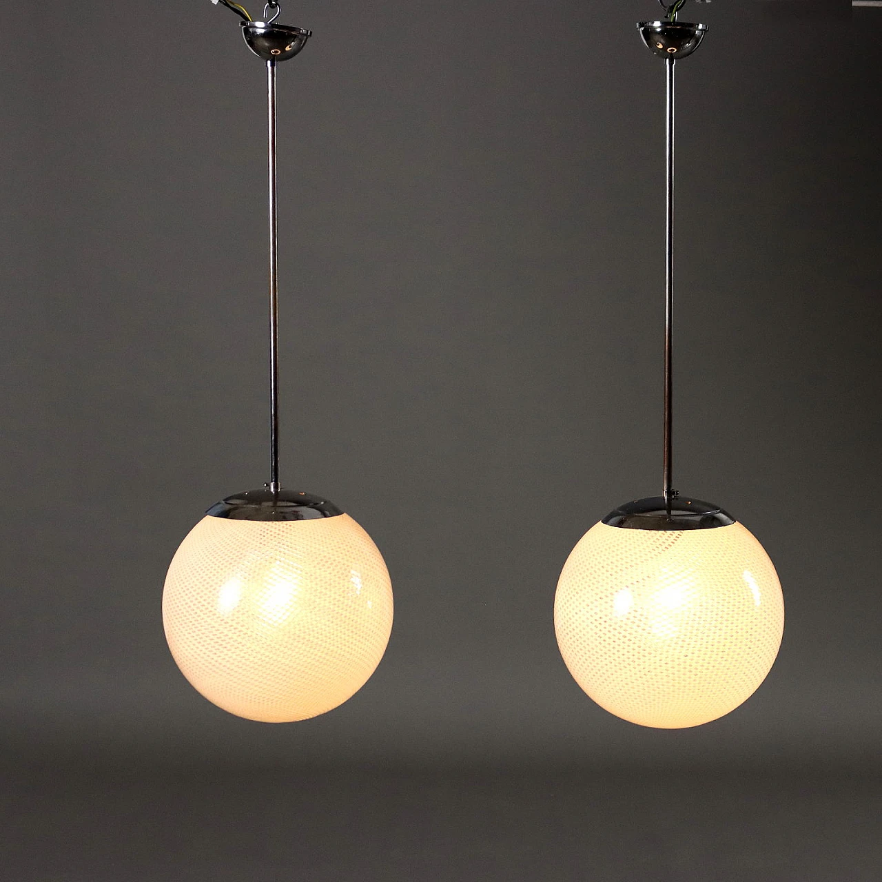 Pair of metal chandeliers with worked glass spheres, 1960s 1